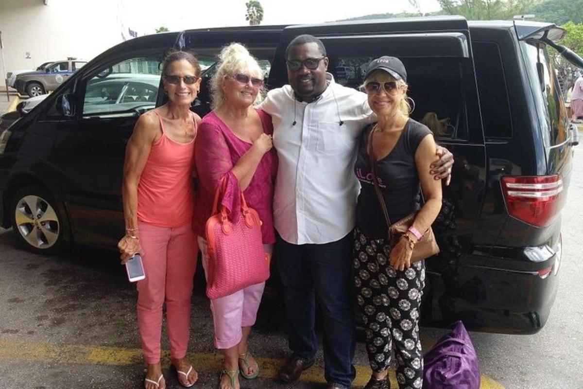 a group of people standing in front of a van