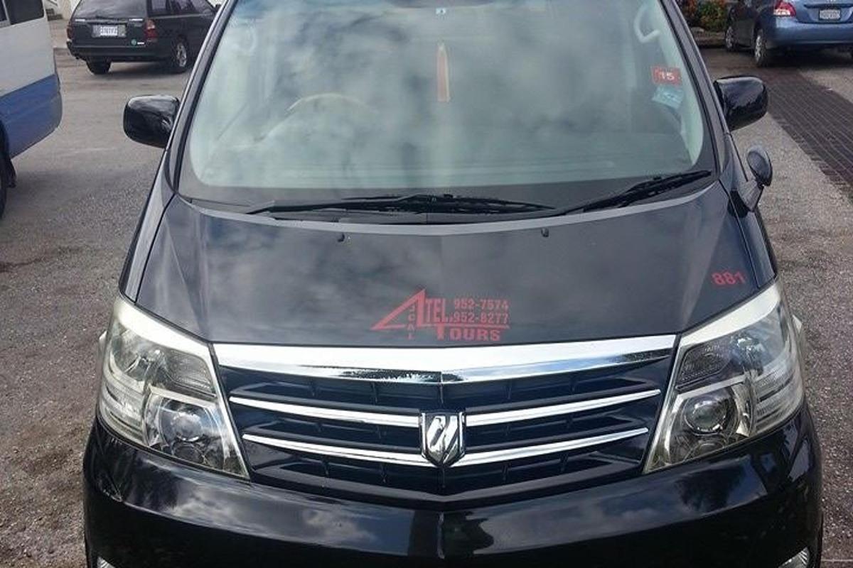 a silver van parked in a parking lot