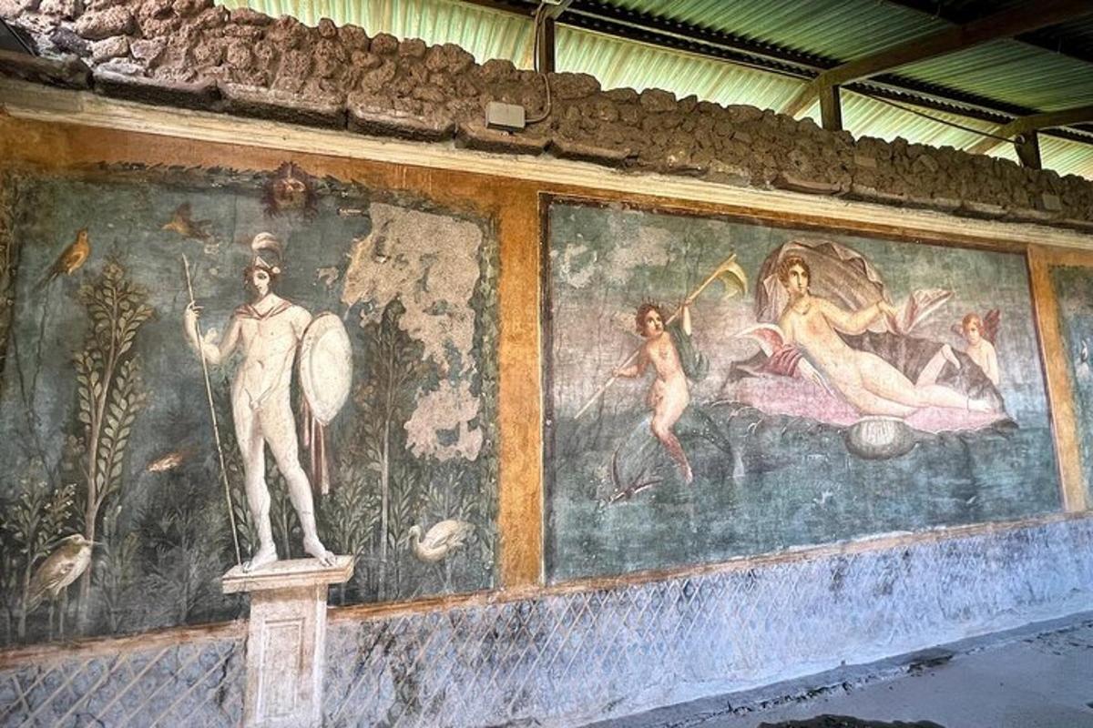 a wall with a painting of a man and a woman
