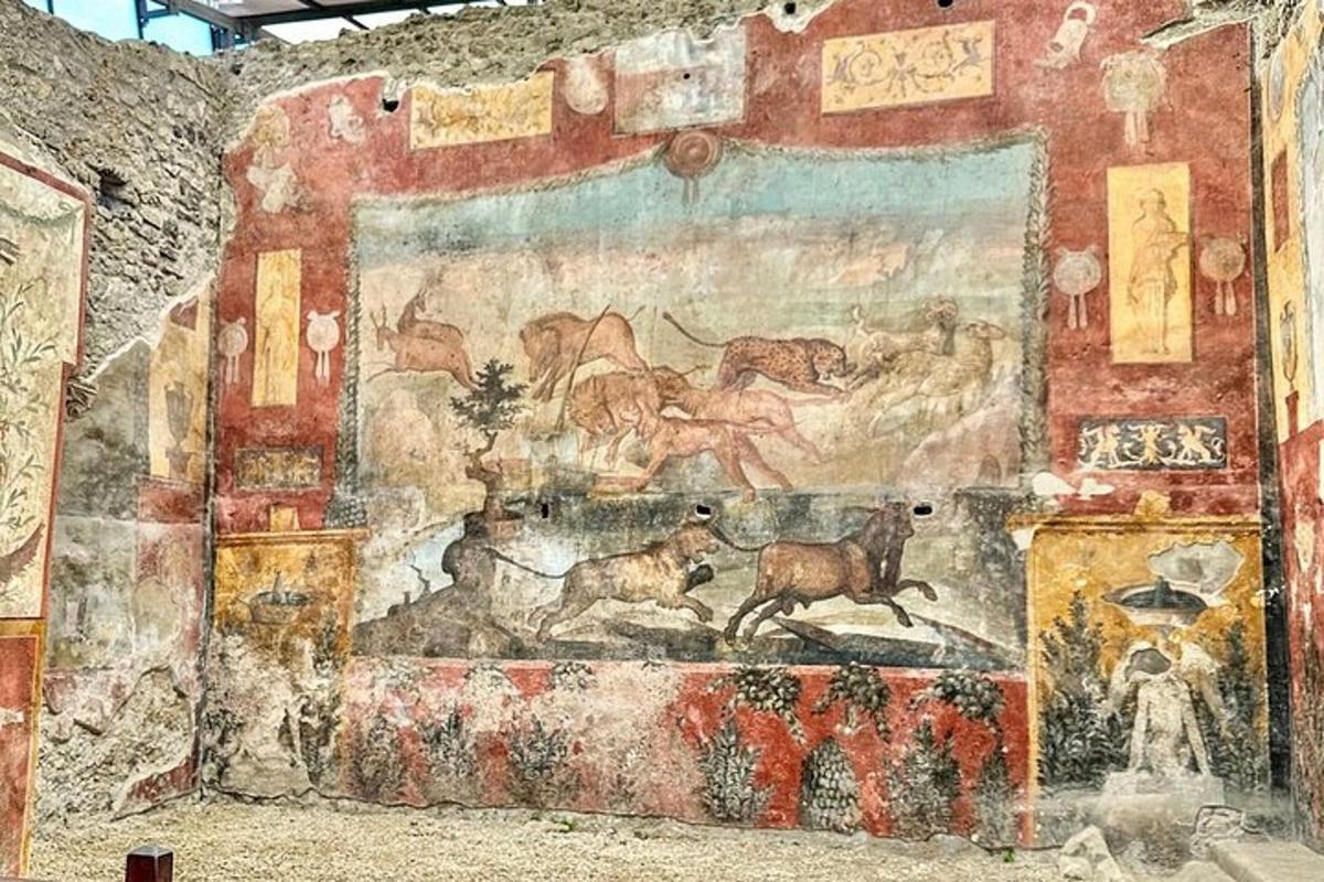a mural on the side of a wall with animals on it