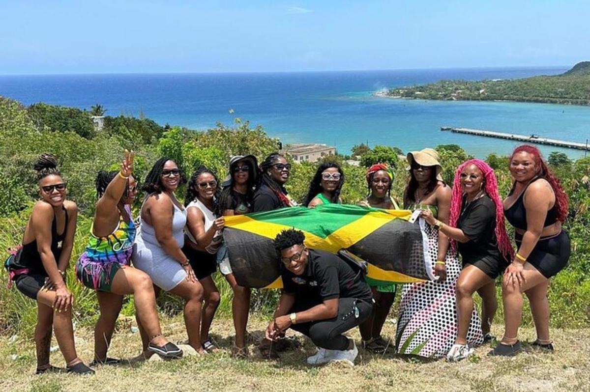 a group of people posing for a picture with a flag