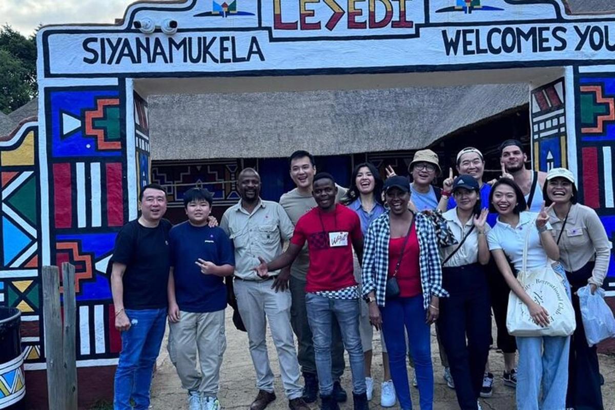 a group of people standing in front of a sign
