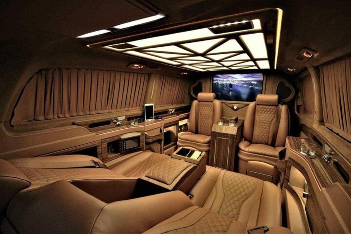 an inside view of a car with seats and lights