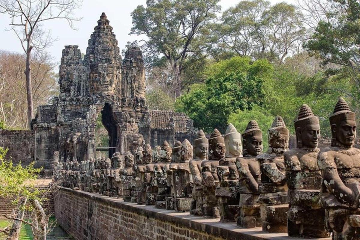 a group of statues on a wall in front of a building