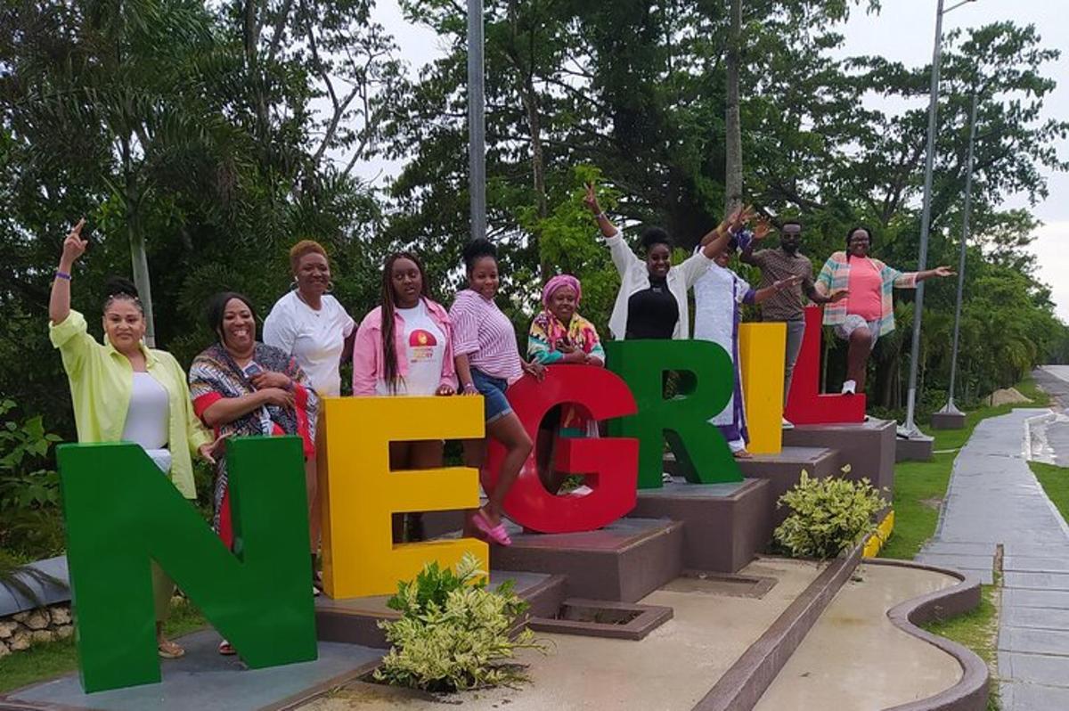 a group of people holding up a sign that says new