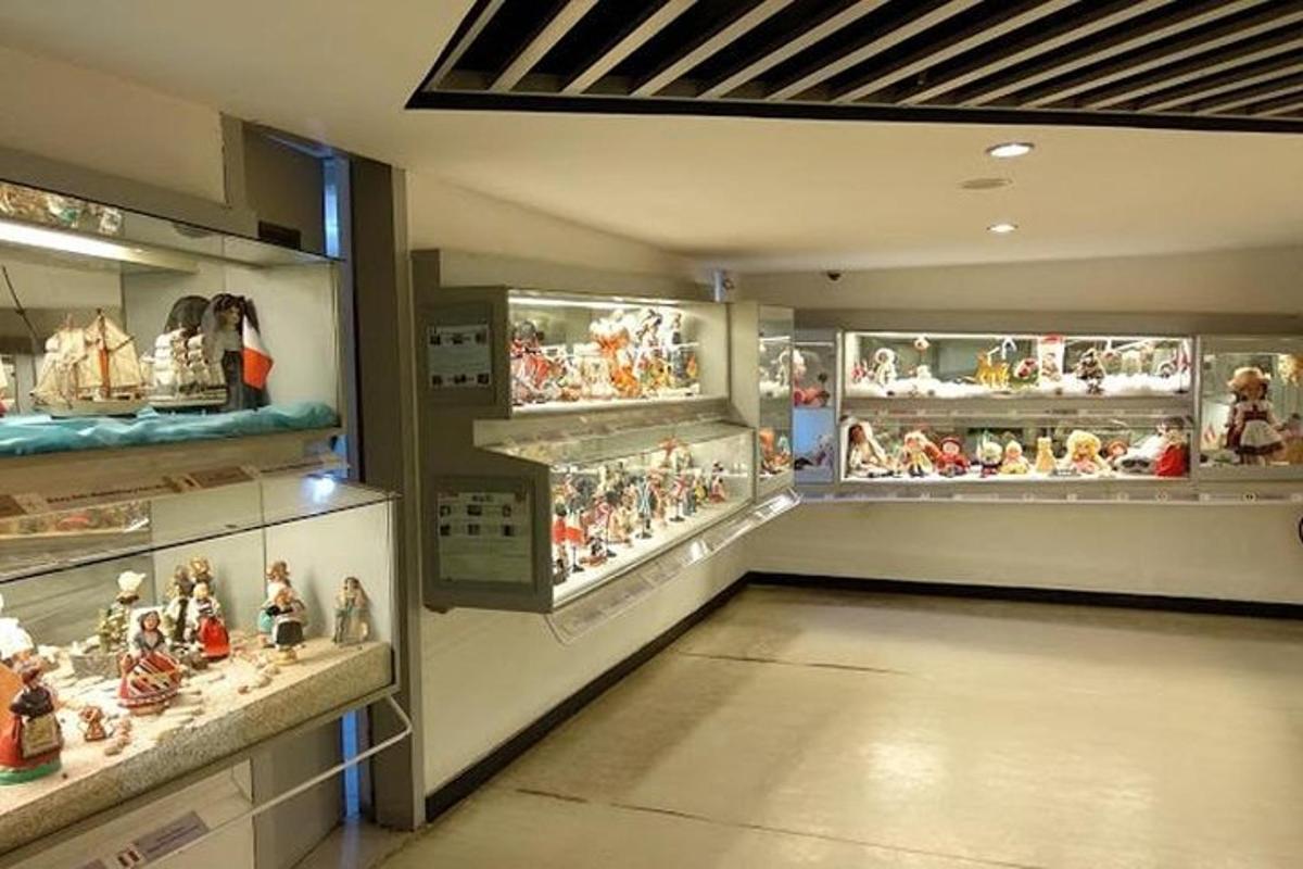 a room filled with lots of figurines on display