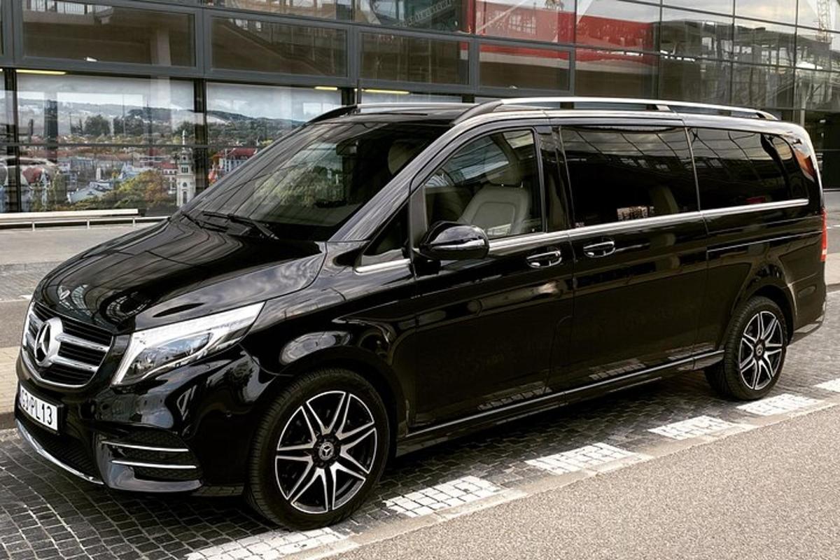 a black van parked in front of a building