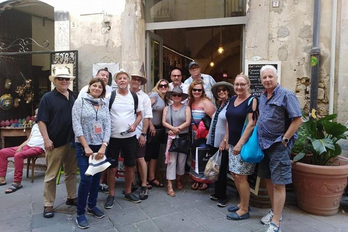 a group of people posing for a picture outside a building