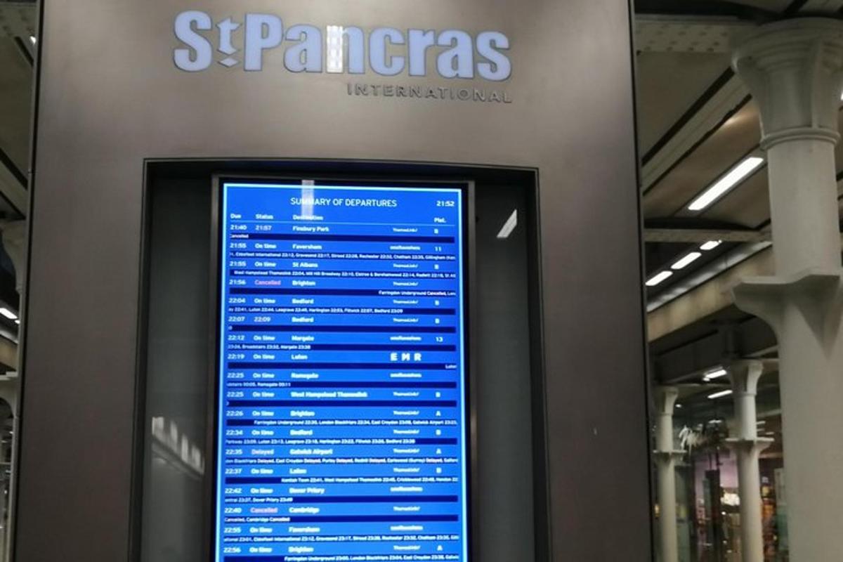 a display of a screen in a building with a sign