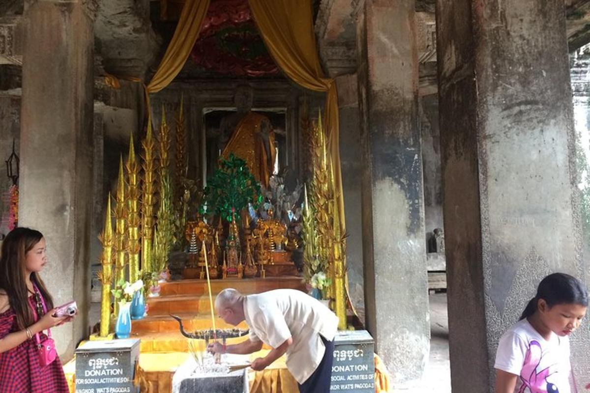 a man standing in front of a temple