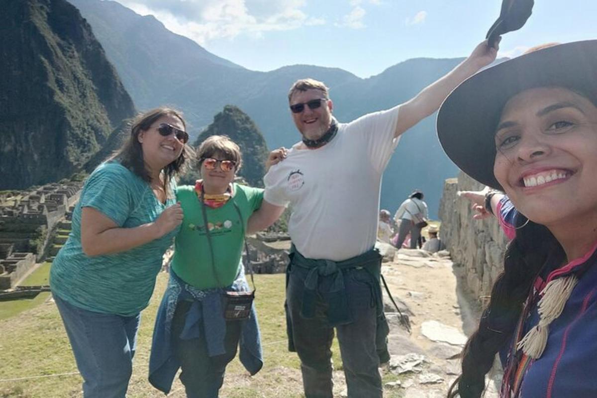 a group of people standing on top of a mountain