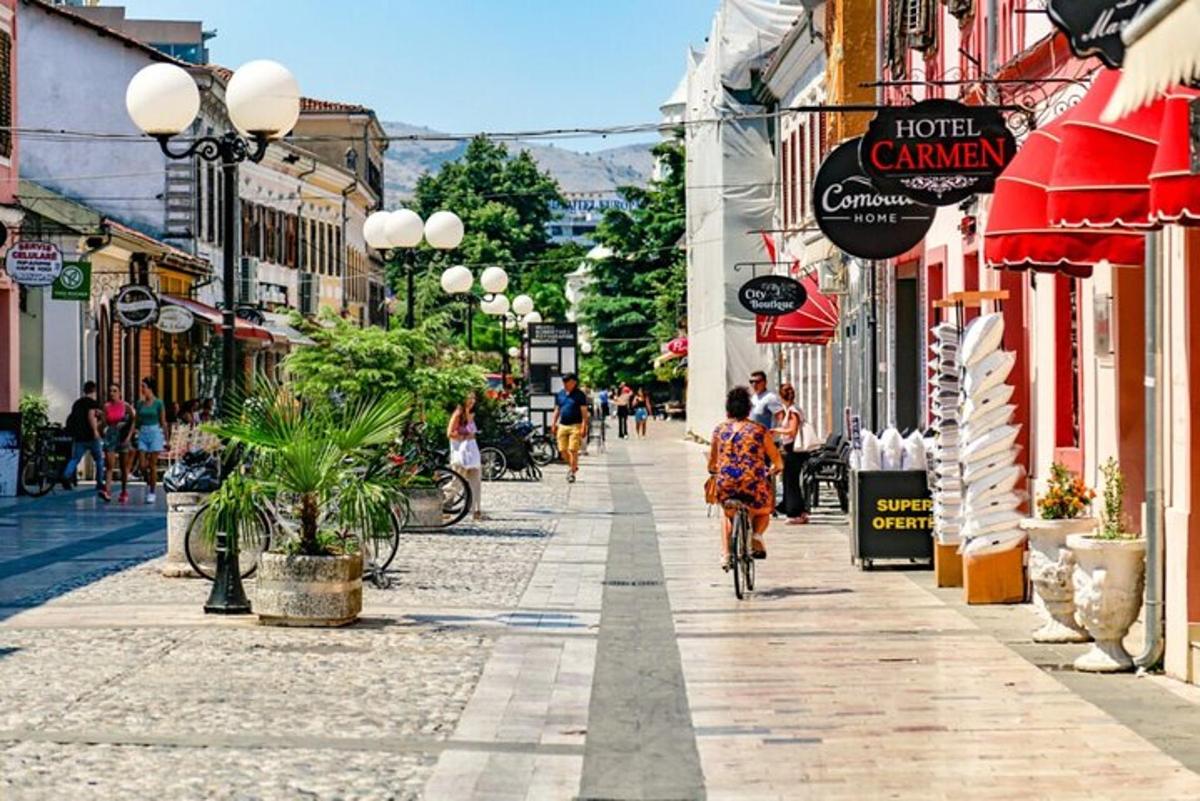 a person riding a bike down a street