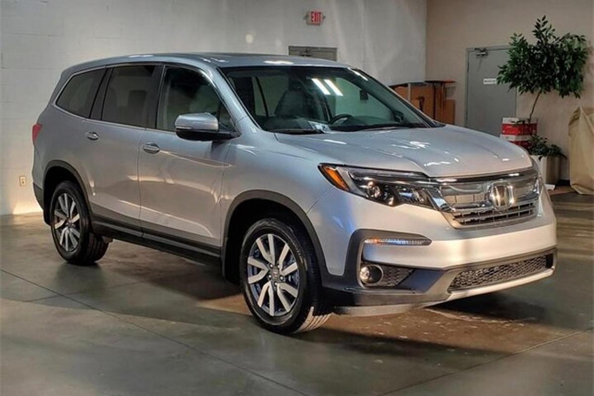 a silver suv parked in a garage