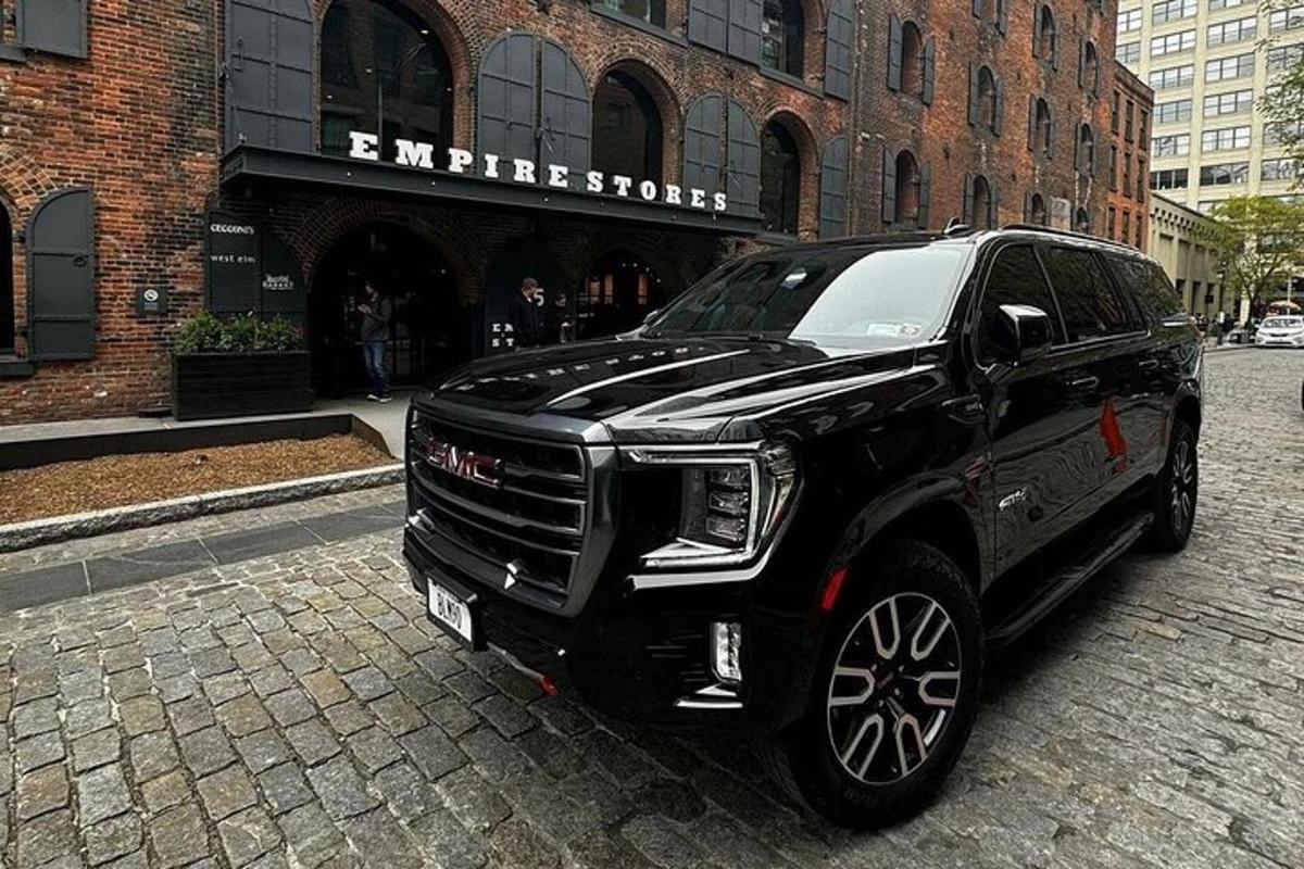 a black truck parked on a city street