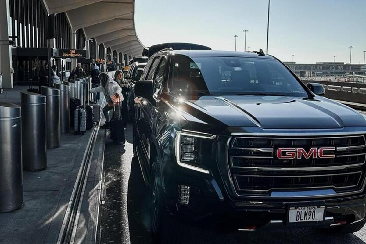 a gmc truck parked on the side of a road