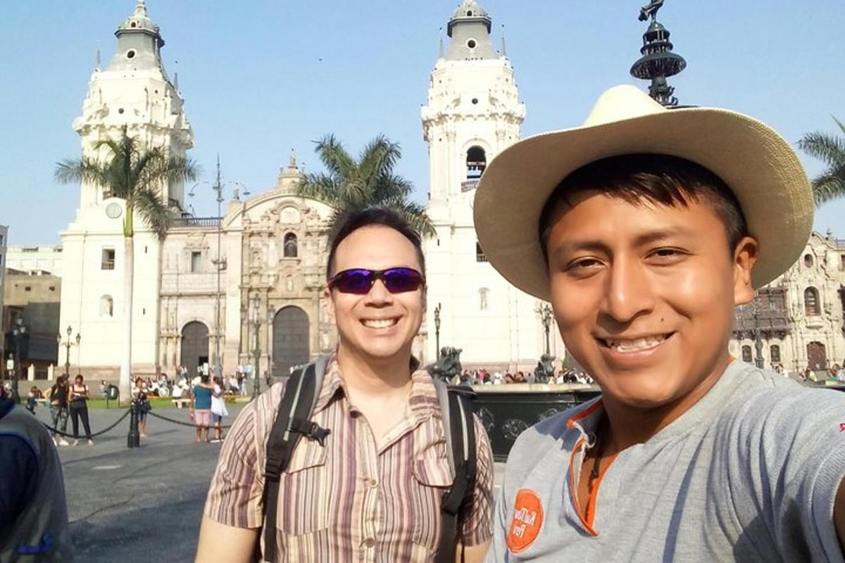two men are standing in front of a building