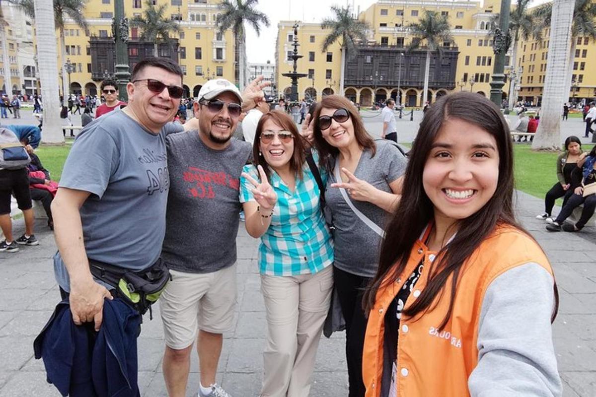 a group of people posing for a picture in a city