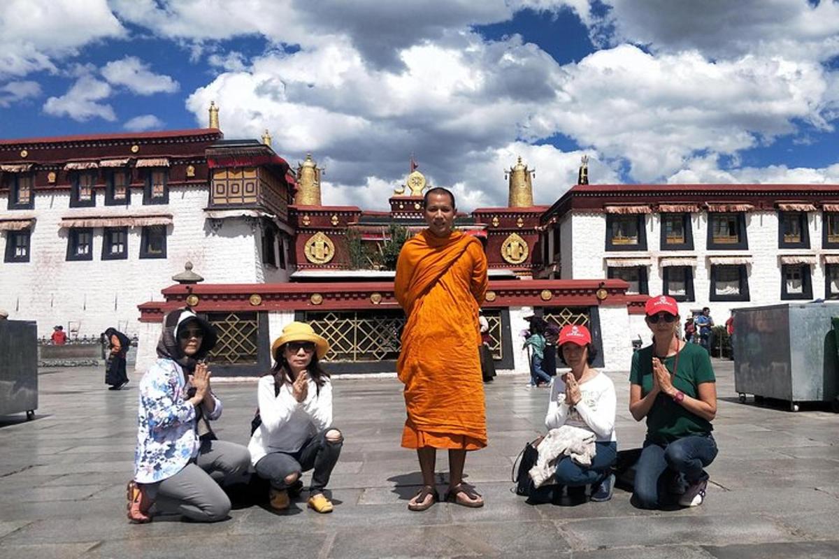 a group of people posing in front of a building
