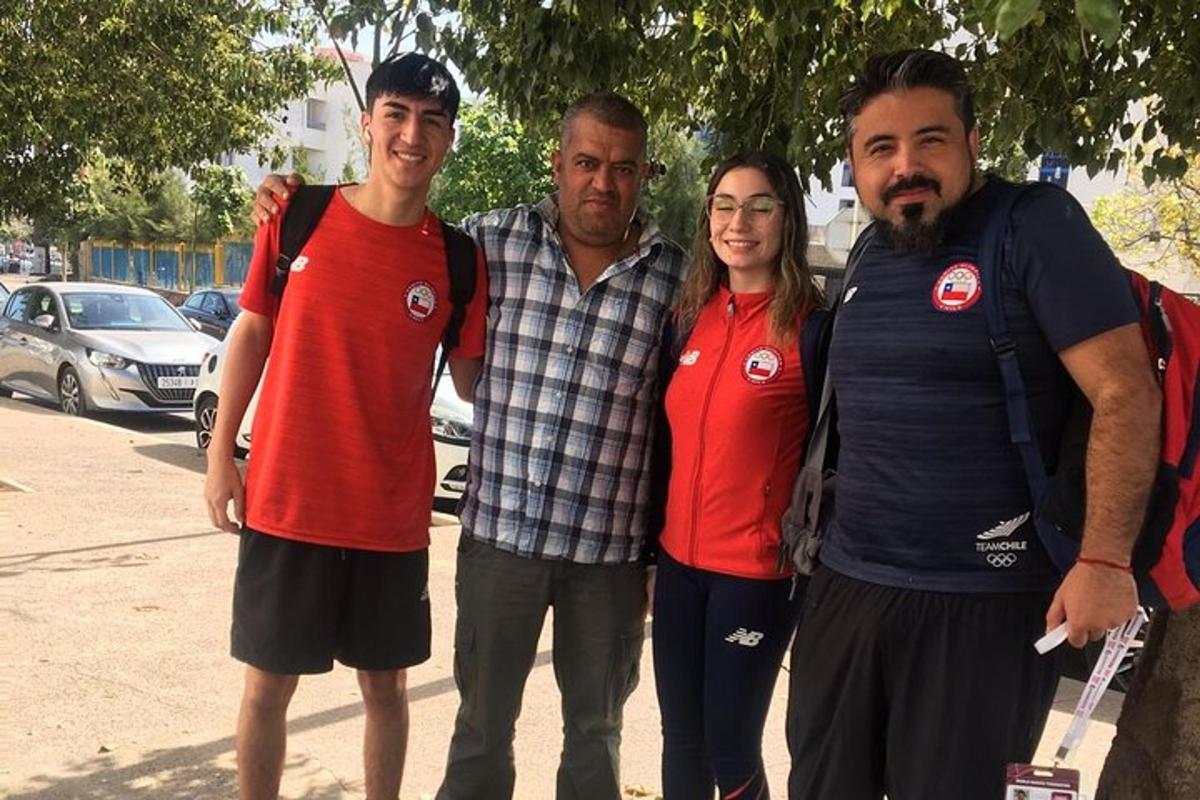 a group of four people posing for a picture
