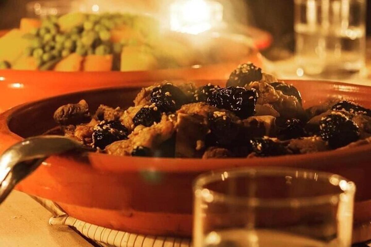 a dish of food in a red bowl on a table