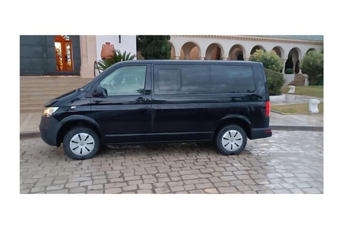 a black van parked on a brick street