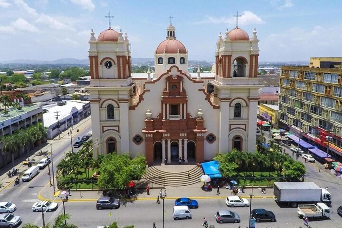 a church in a city with cars parked in a parking lot
