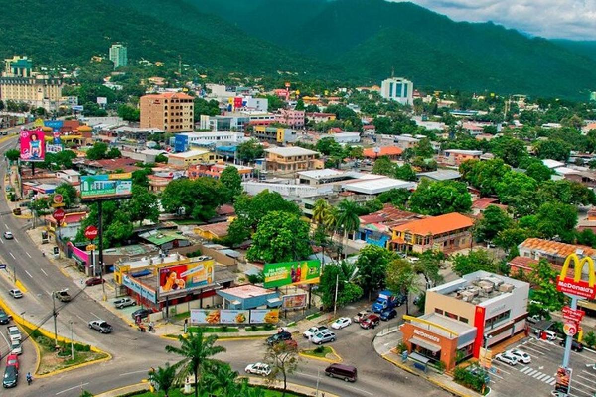 an overhead view of a city with a street