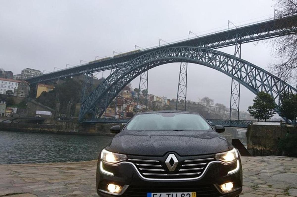 a car parked in front of a bridge