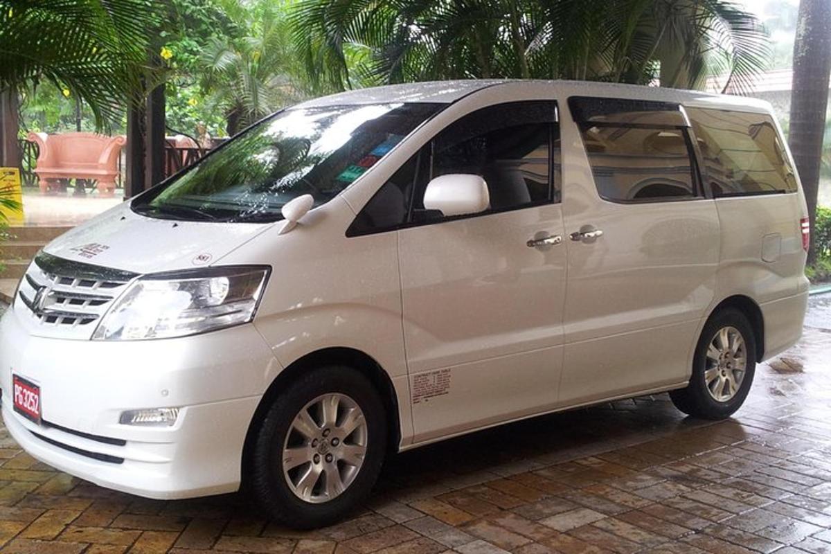 a white van parked on a brick street