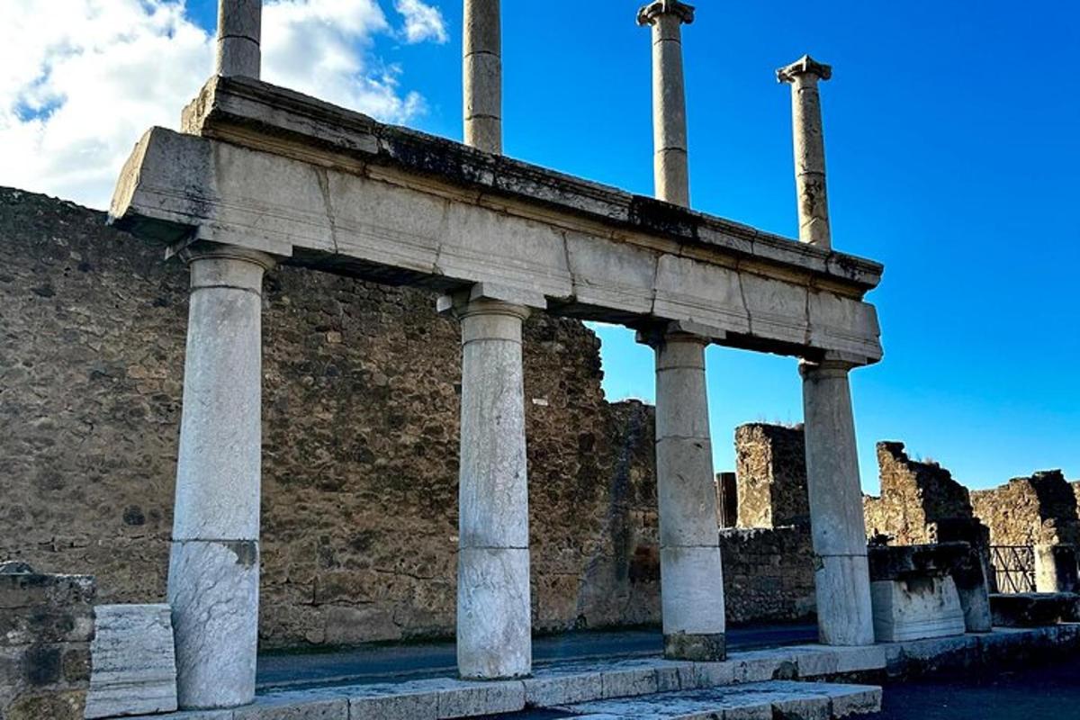 ancient ruins of a building with columns on a wall
