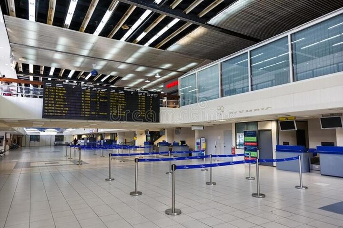an airport terminal with a check in counter