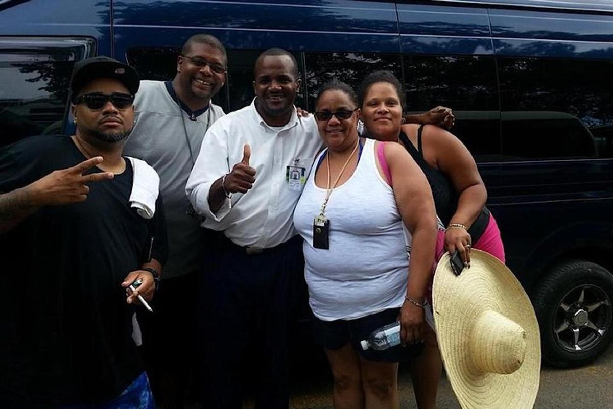 a group of people standing in front of a van