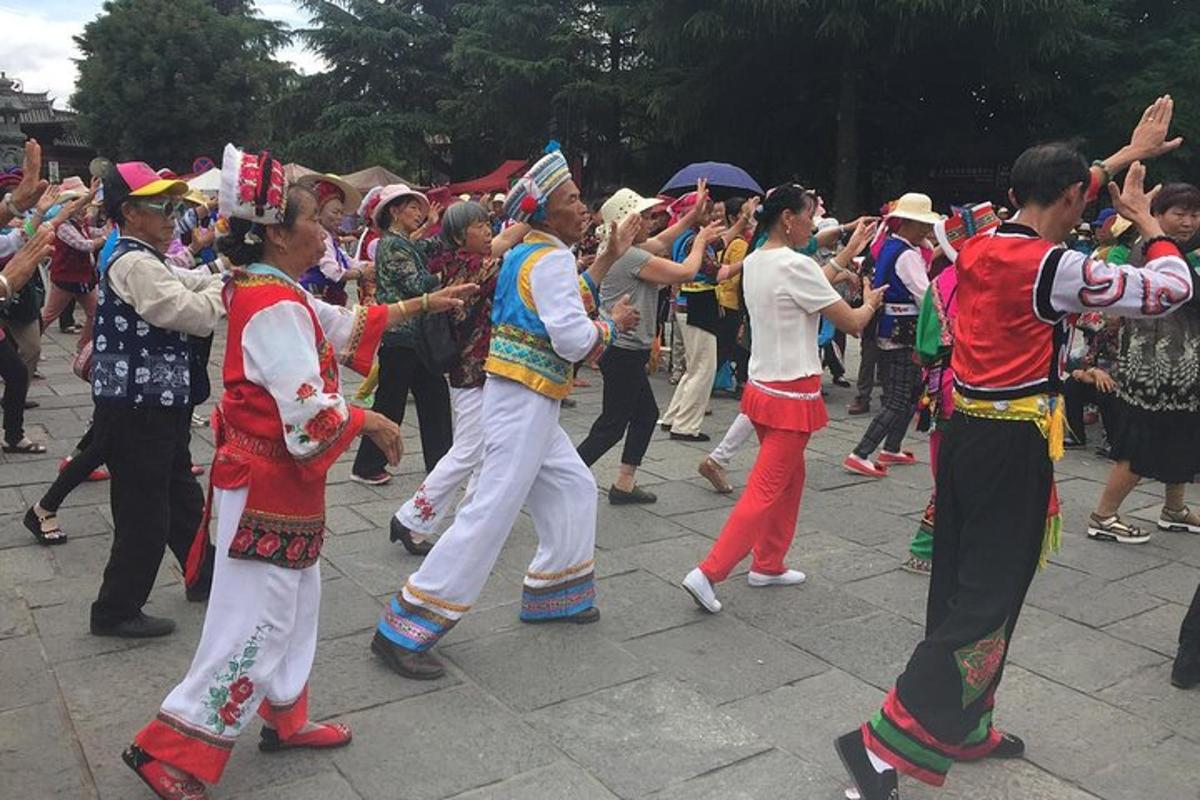 a group of people dancing in a street