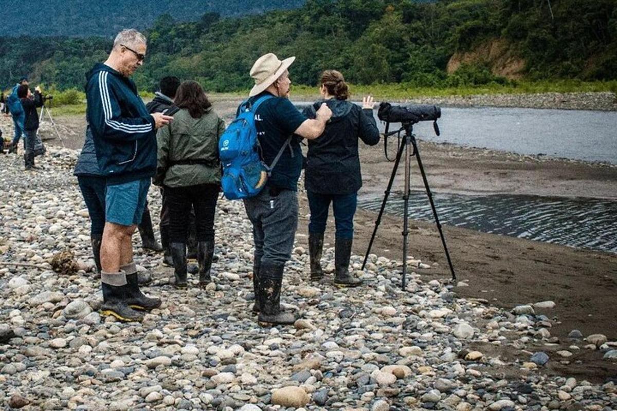 a group of people standing on a beach with a camera