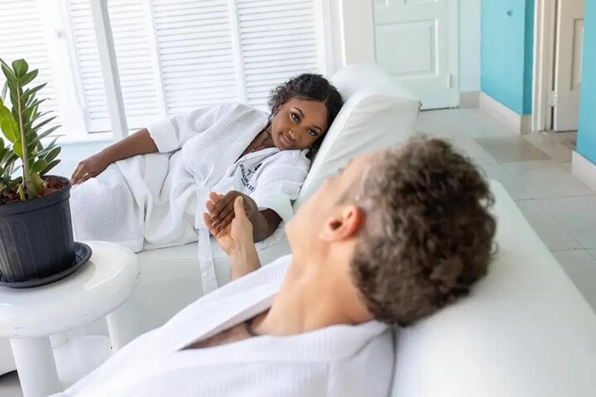 a man and a woman laying in a hospital bed