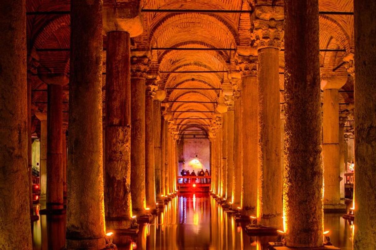 a hallway of a building with columns and ceilings