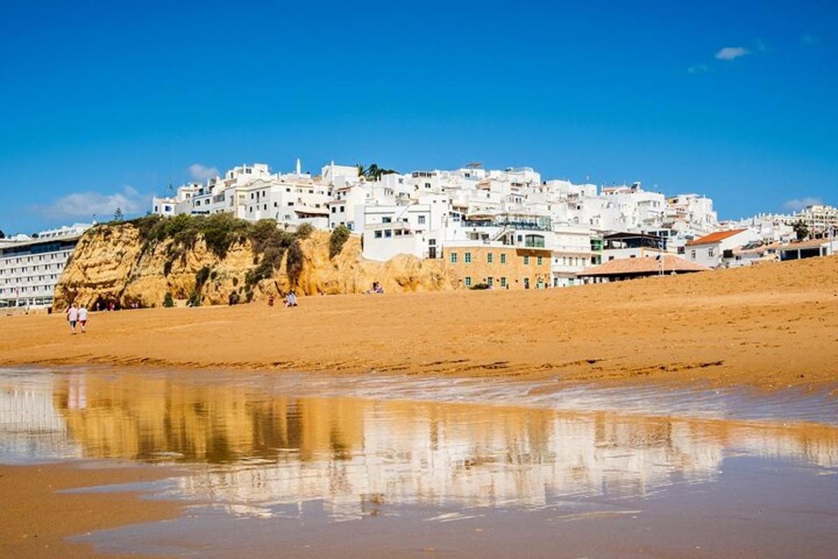 a view of a beach with white buildings