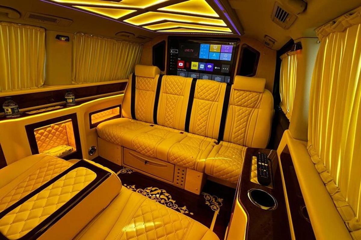a small train room with two beds and a couch