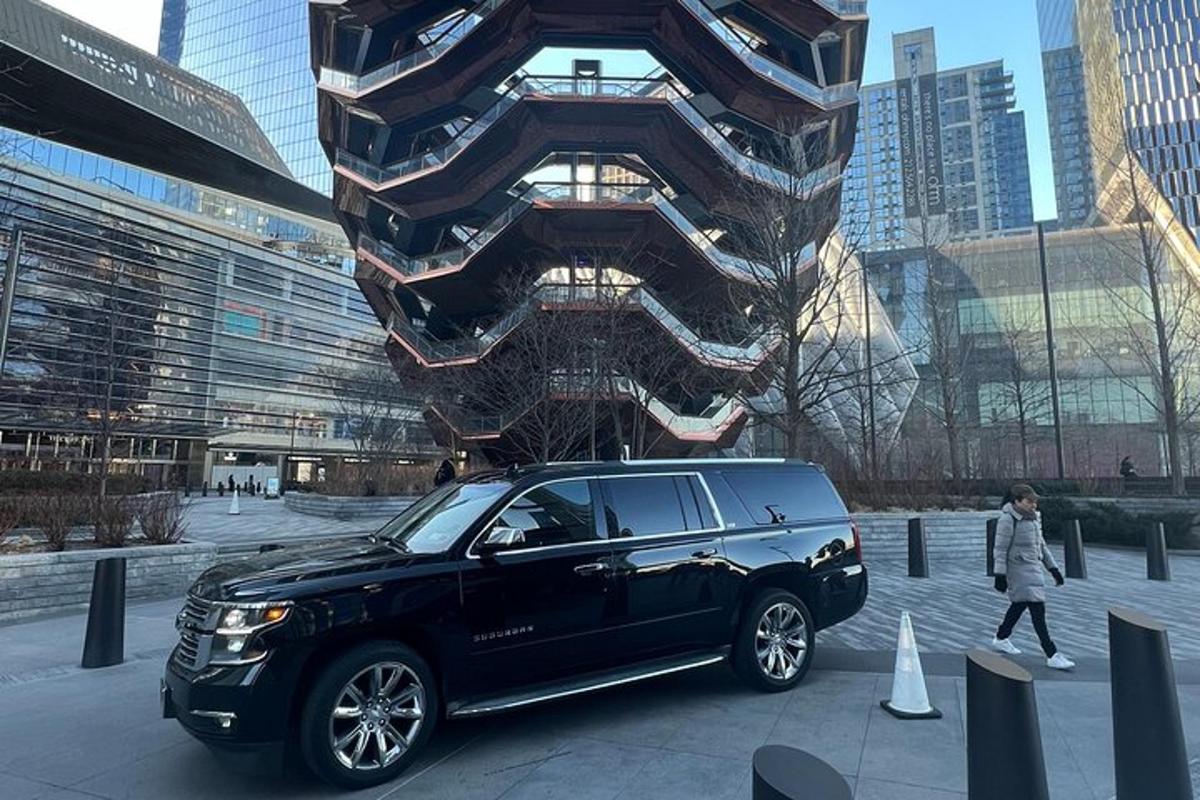 a black suv parked in front of a building