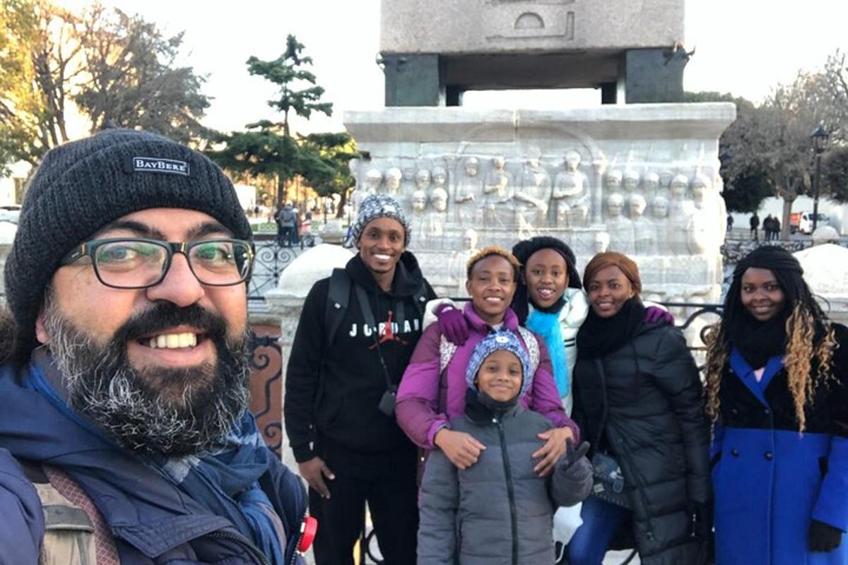 a group of people standing in front of a monument