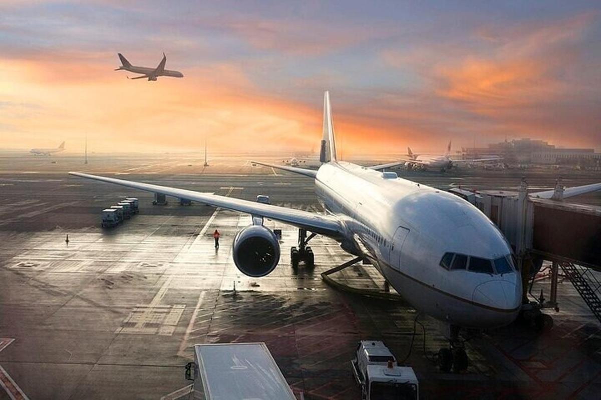 an airplane is parked on the runway at an airport
