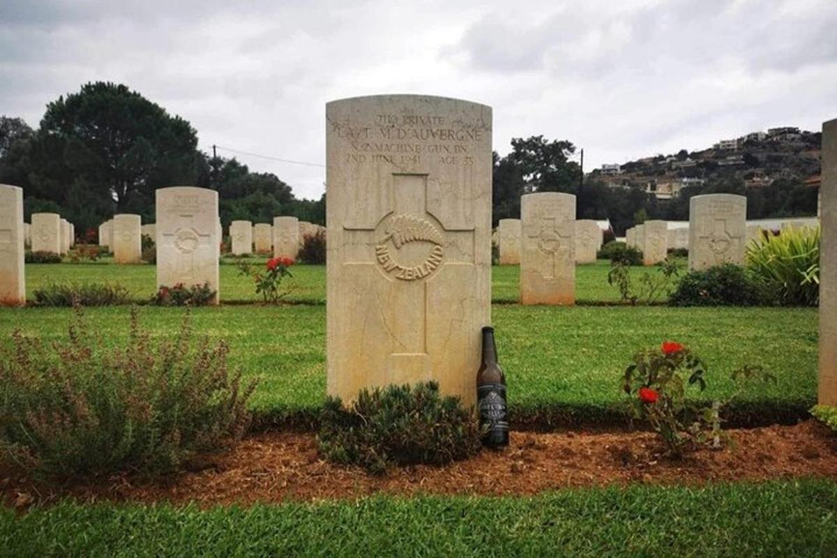 a bunch of graves with a door in the grass