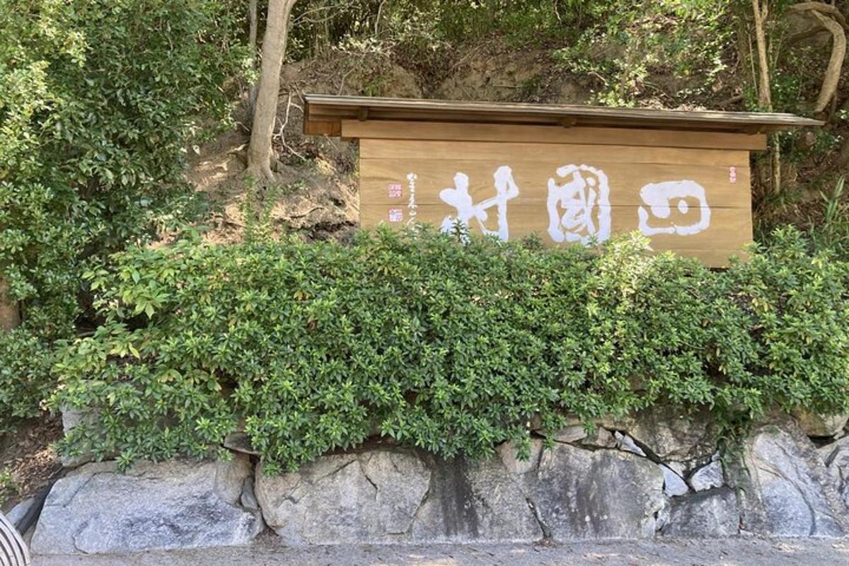 a sign on a rock with writing on it