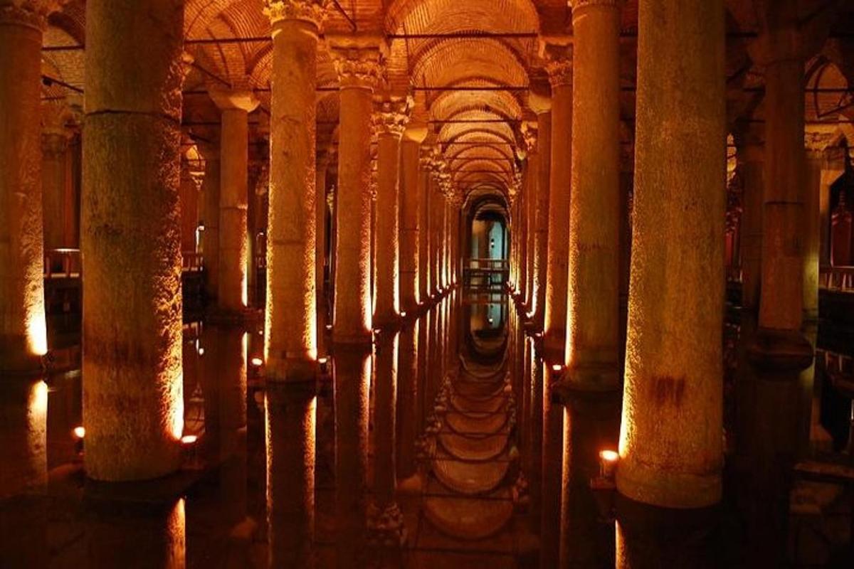 a row of columns in a building with lights