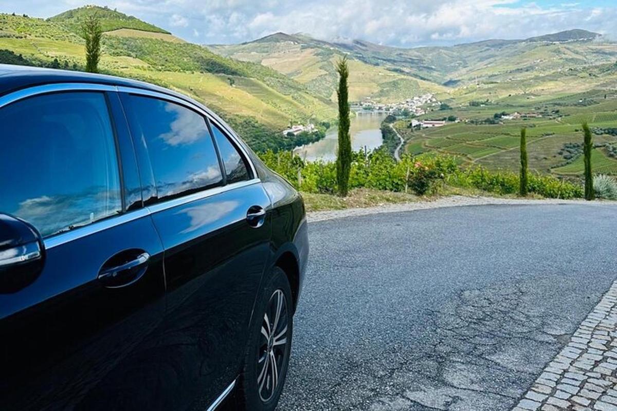 a blue car parked on the side of a road
