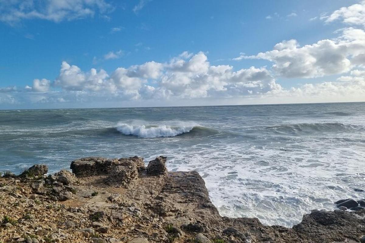 a wave in the ocean on a rocky beach
