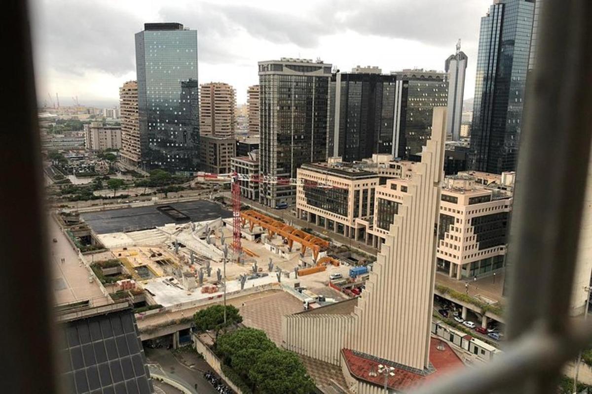 a view of a city with a tall building