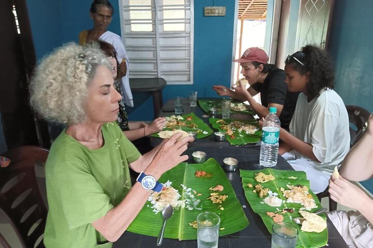 a group of people sitting at a table eating food