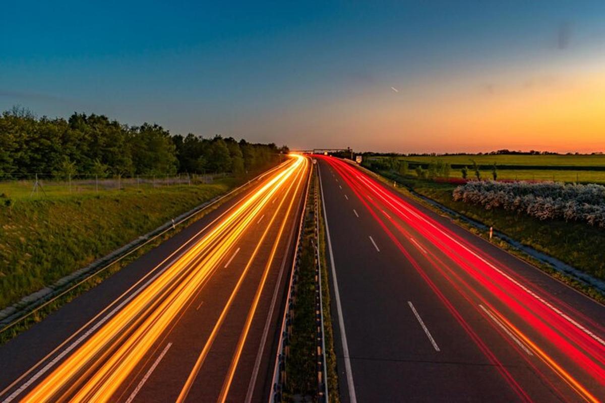 a highway at night with lights on the road