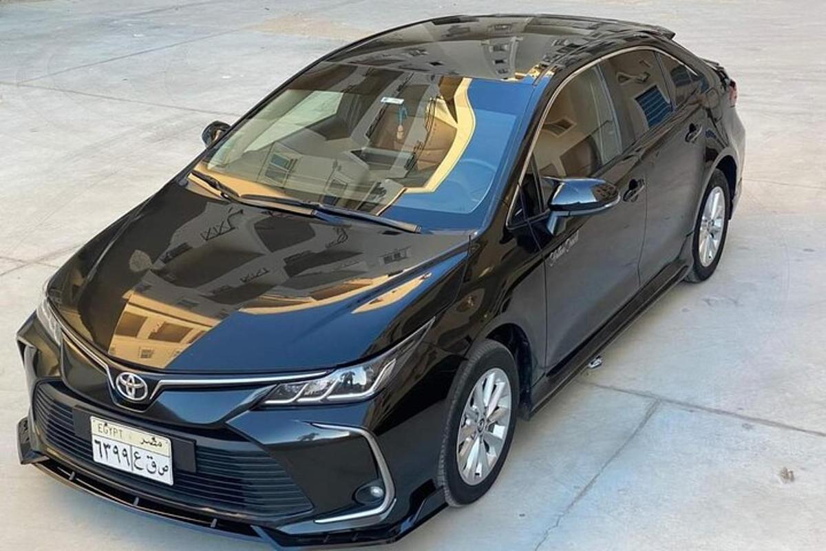 a black car parked in a parking lot
